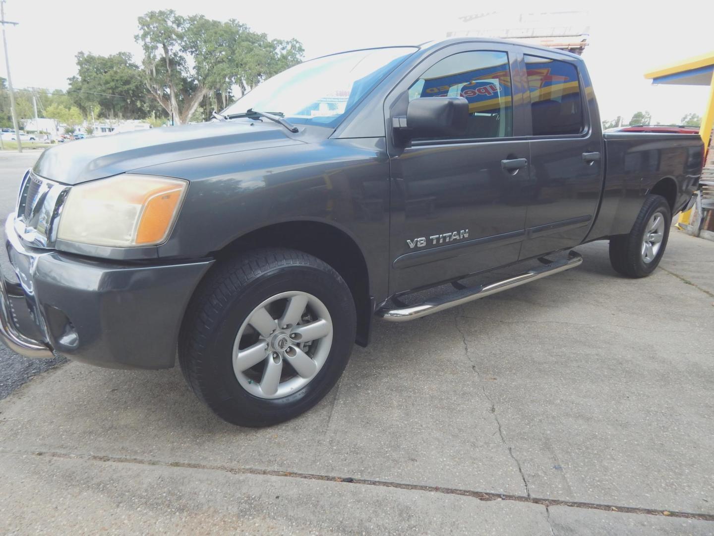 2010 Charcoal Metallic /Charcoal Nissan Titan SE Crew Cab 4WD (1N6AA0FJ3AN) with an 5.6L V8 DOHC 32V engine, 5-Speed Automatic transmission, located at 3120 W Tennessee St, Tallahassee, FL, 32304-1002, (850) 575-6702, 30.458841, -84.349648 - Photo#0