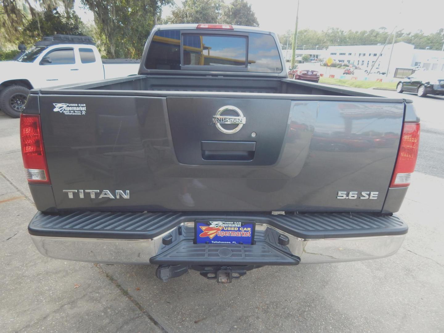 2010 Charcoal Metallic /Charcoal Nissan Titan SE Crew Cab 4WD (1N6AA0FJ3AN) with an 5.6L V8 DOHC 32V engine, 5-Speed Automatic transmission, located at 3120 W Tennessee St, Tallahassee, FL, 32304-1002, (850) 575-6702, 30.458841, -84.349648 - Photo#2