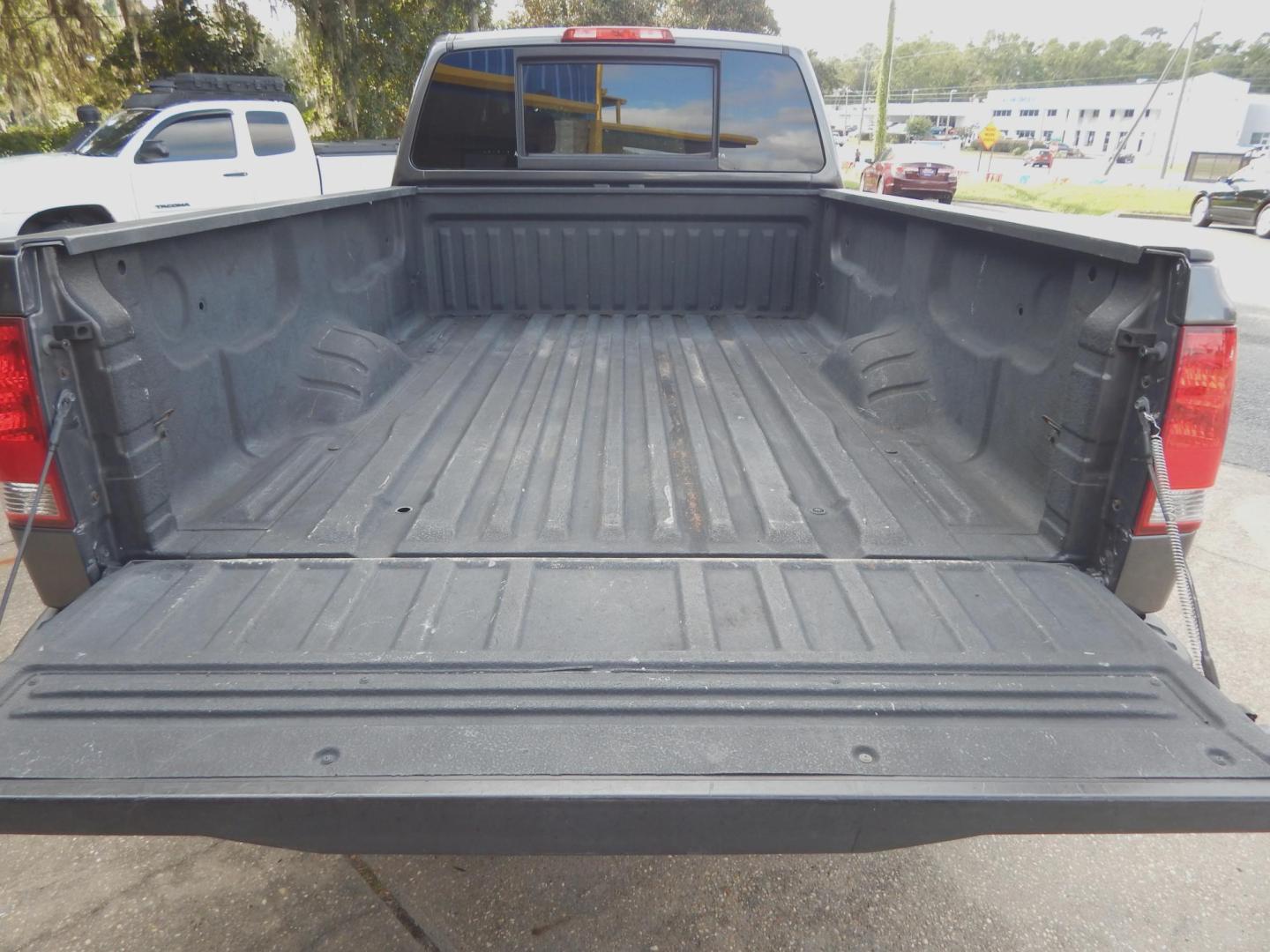 2010 Charcoal Metallic /Charcoal Nissan Titan SE Crew Cab 4WD (1N6AA0FJ3AN) with an 5.6L V8 DOHC 32V engine, 5-Speed Automatic transmission, located at 3120 W Tennessee St, Tallahassee, FL, 32304-1002, (850) 575-6702, 30.458841, -84.349648 - Photo#3