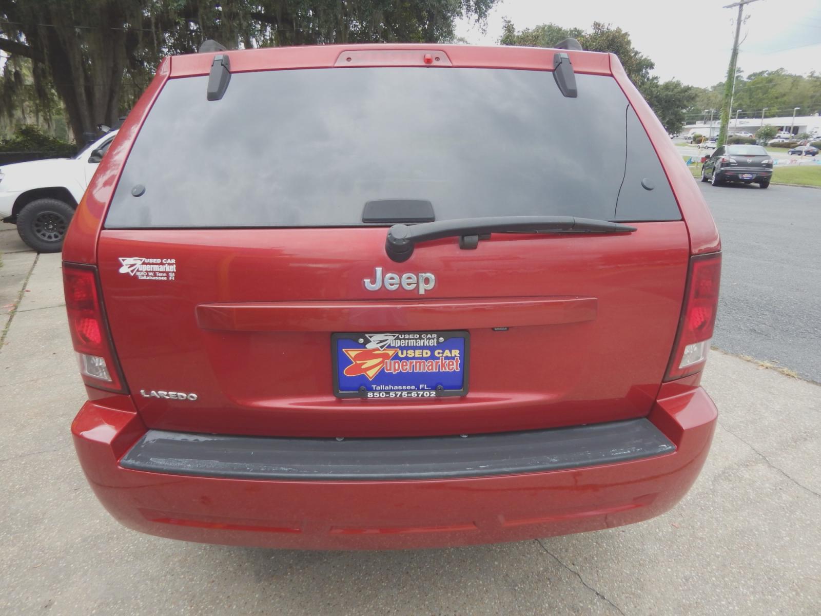 2010 Maroon /Gray Jeep Grand Cherokee Laredo 2WD (1J4PS4GK6AC) with an 3.7L V6 SOHC 12V engine, 5-Speed Automatic transmission, located at 3120 W Tennessee St, Tallahassee, FL, 32304-1002, (850) 575-6702, 30.458841, -84.349648 - Used Car Supermarket is proud to present you with this loaded immaculate 2010 Jeep Grand Cherokee Laredo with low miles. Used Car Supermarket prides itself in offering you the finest pre-owned vehicle in Tallahassee. Used Car Supermarket has been locally family owned and operated for over 48 years. - Photo #3