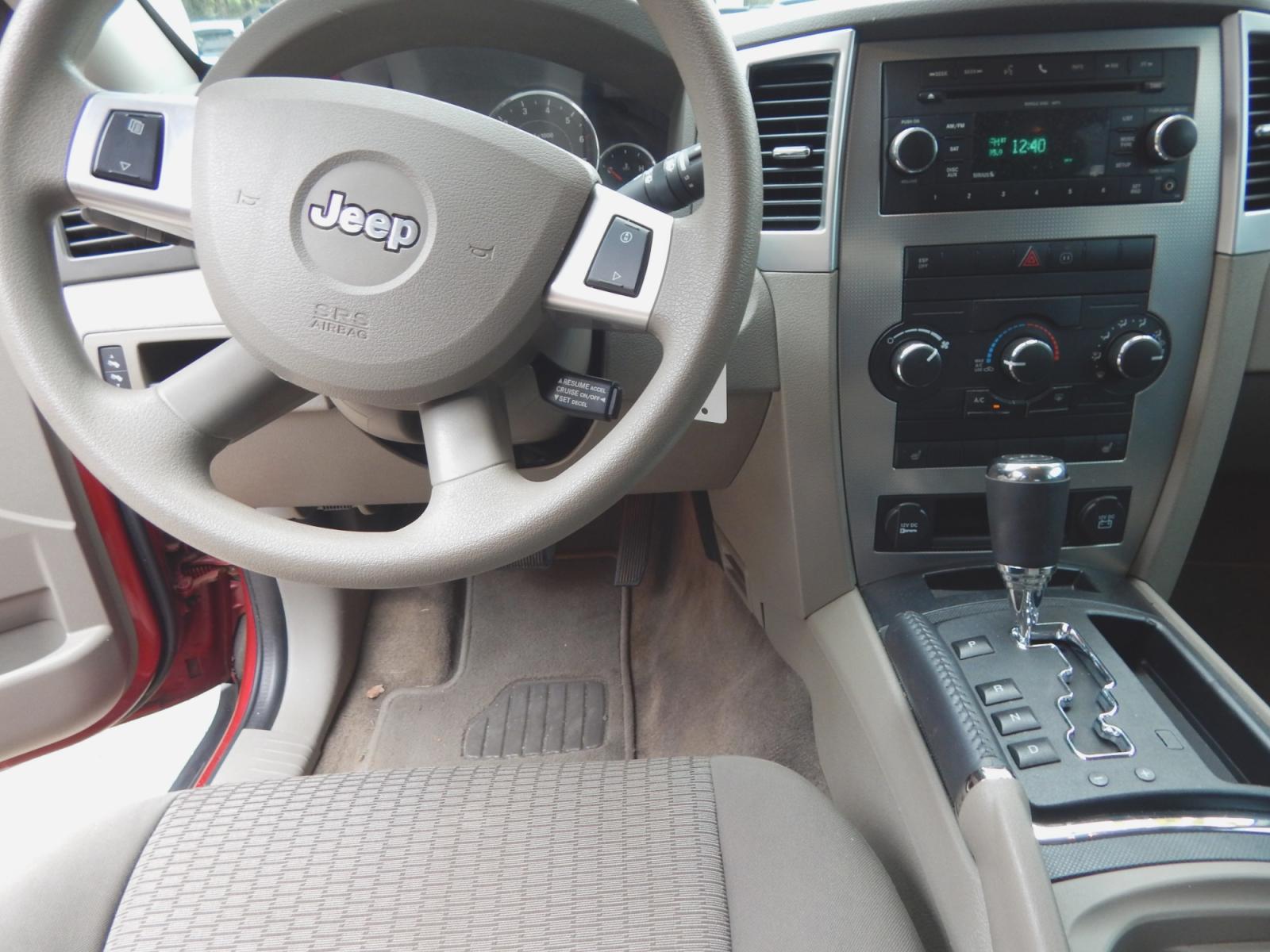 2010 Maroon /Gray Jeep Grand Cherokee Laredo 2WD (1J4PS4GK6AC) with an 3.7L V6 SOHC 12V engine, 5-Speed Automatic transmission, located at 3120 W Tennessee St, Tallahassee, FL, 32304-1002, (850) 575-6702, 30.458841, -84.349648 - Used Car Supermarket is proud to present you with this loaded immaculate 2010 Jeep Grand Cherokee Laredo with low miles. Used Car Supermarket prides itself in offering you the finest pre-owned vehicle in Tallahassee. Used Car Supermarket has been locally family owned and operated for over 48 years. - Photo #4