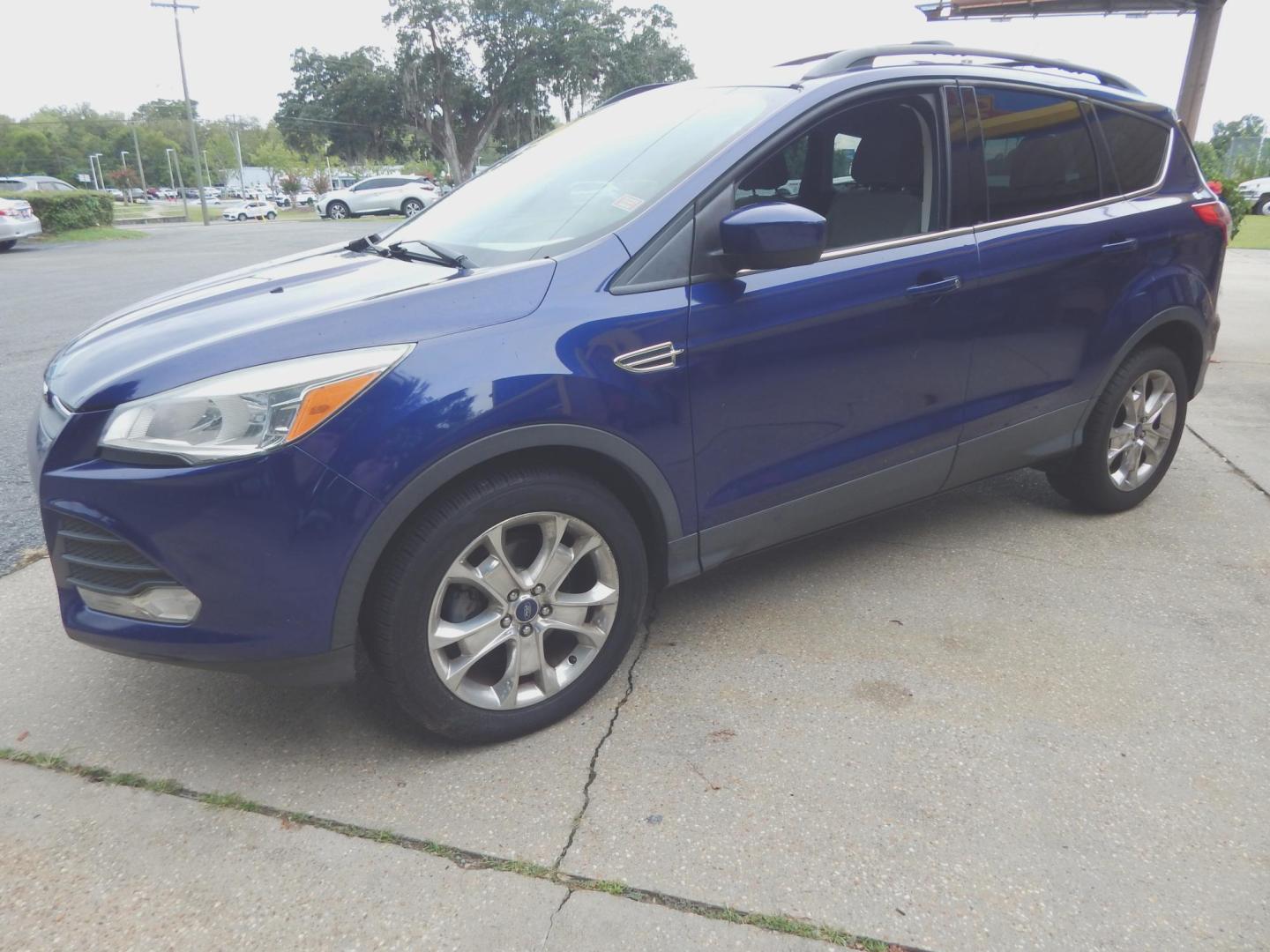 2013 Blue /Gray Ford Escape SE (1FMCU0GX3DU) with an 1.6L 4 cyl. engine, Automatic transmission, located at 3120 W Tennessee St, Tallahassee, FL, 32304-1002, (850) 575-6702, 30.458841, -84.349648 - Used Car Supermarket is proud to present you with this loaded immaculate 2013 Ford Escape SE with low miles. Used Car Supermarket prides itself in offering you the finest pre-owned vehicle in Tallahassee. Used Car Supermarket has been locally family owned and operated for over 50 years. Our Escape S - Photo#1