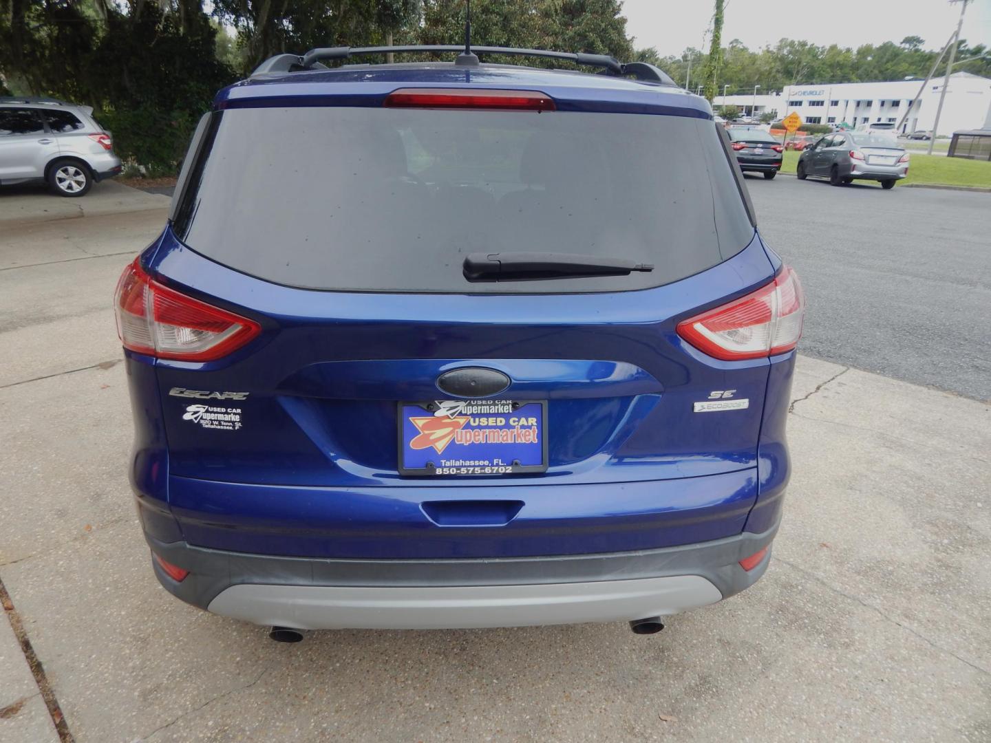 2013 Blue /Gray Ford Escape SE (1FMCU0GX3DU) with an 1.6L 4 cyl. engine, Automatic transmission, located at 3120 W Tennessee St, Tallahassee, FL, 32304-1002, (850) 575-6702, 30.458841, -84.349648 - Used Car Supermarket is proud to present you with this loaded immaculate 2013 Ford Escape SE with low miles. Used Car Supermarket prides itself in offering you the finest pre-owned vehicle in Tallahassee. Used Car Supermarket has been locally family owned and operated for over 50 years. Our Escape S - Photo#3