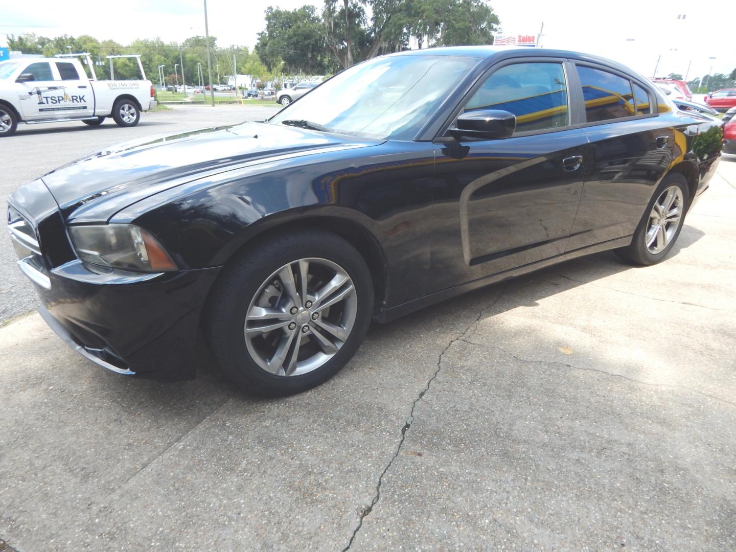 2013 Black /Charcoal Dodge Charger SXT (2C3CDXJG0DH) with an 3.6L 6 Cyl. engine, Automatic transmission, located at 3120 W Tennessee St, Tallahassee, FL, 32304-1002, (850) 575-6702, 30.458841, -84.349648 - Photo#1