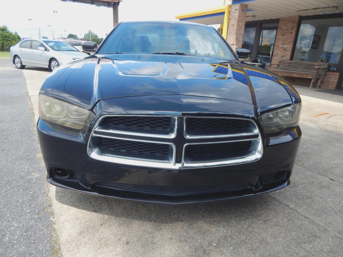 2013 Black /Charcoal Dodge Charger SXT (2C3CDXJG0DH) with an 3.6L 6 Cyl. engine, Automatic transmission, located at 3120 W Tennessee St, Tallahassee, FL, 32304-1002, (850) 575-6702, 30.458841, -84.349648 - Used Car Supermarket is proud to present you with this loaded immaculate 2013 Dodge Charger SXT with low miles. Used Car Supermarket prides itself in offering you the finest pre-owned vehicle in Tallahassee. Used Car Supermarket has been locally family owned and operated for over 48 years. Our Charg - Photo#2