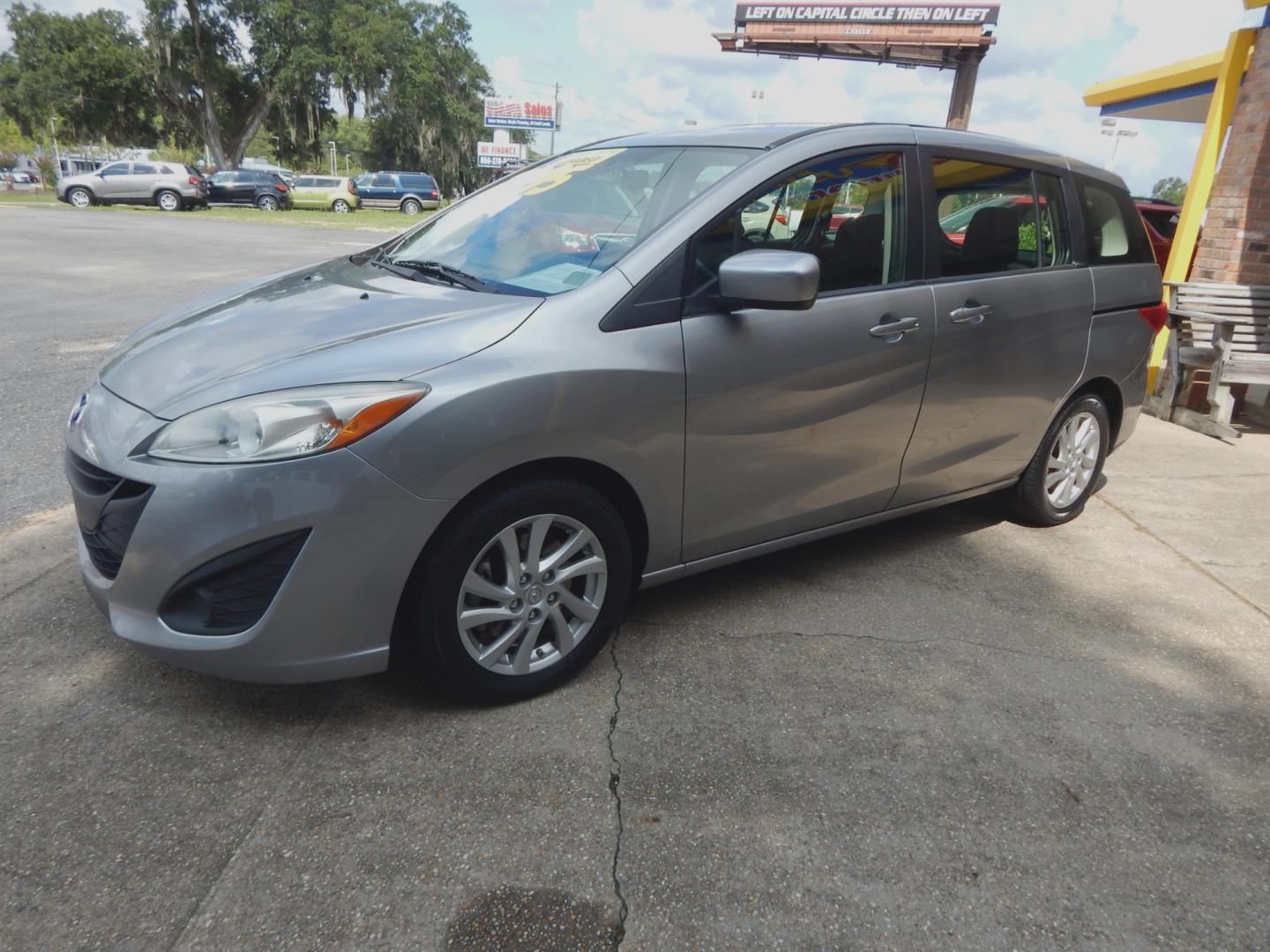 2012 Silver Metallic /Gray Mazda MAZDA5 Sport (JM1CW2BL6C0) with an 2.5l-4 cyl. engine, Automatic transmission, located at 3120 W Tennessee St, Tallahassee, FL, 32304-1002, (850) 575-6702, 30.458841, -84.349648 - Used Car Supermarket is proud to present you with this loaded immaculate 2012 Mazda5 Sport with 3rd row seating. Used Car Supermarket prides itself in offering you the finest pre-owned vehicle in Tallahassee. Used Car Supermarket has been locally family owned and operated for over 48 years. Our Mazd - Photo#1