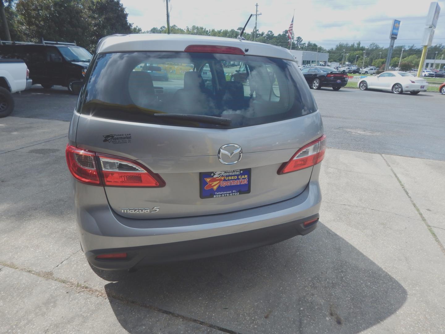 2012 Silver Metallic /Gray Mazda MAZDA5 Sport (JM1CW2BL6C0) with an 2.5l-4 cyl. engine, Automatic transmission, located at 3120 W Tennessee St, Tallahassee, FL, 32304-1002, (850) 575-6702, 30.458841, -84.349648 - Used Car Supermarket is proud to present you with this loaded immaculate 2012 Mazda5 Sport with 3rd row seating. Used Car Supermarket prides itself in offering you the finest pre-owned vehicle in Tallahassee. Used Car Supermarket has been locally family owned and operated for over 48 years. Our Mazd - Photo#3