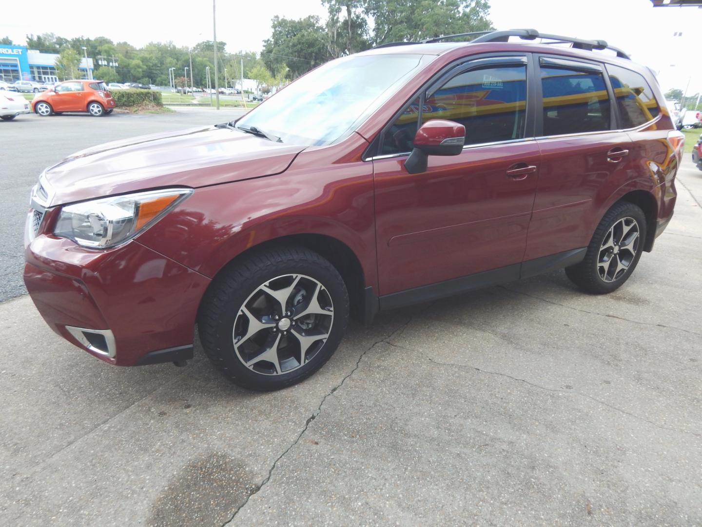 2014 Maroon /Charcoal Leather Subaru Forester XT Touring (JF2SJGMC8EH) with an 2.0L engine, Automatic transmission, located at 3120 W Tennessee St, Tallahassee, FL, 32304-1002, (850) 575-6702, 30.458841, -84.349648 - Used Car Supermarket is proud to present you with this loaded immaculate 2014 Subaru Forester 2.0XT Touring with leather, sunroof, Navigation and low miles . Used Car Supermarket prides itself in offering you the finest pre-owned vehicle in Tallahassee. Used Car Supermarket has been locally family o - Photo#1