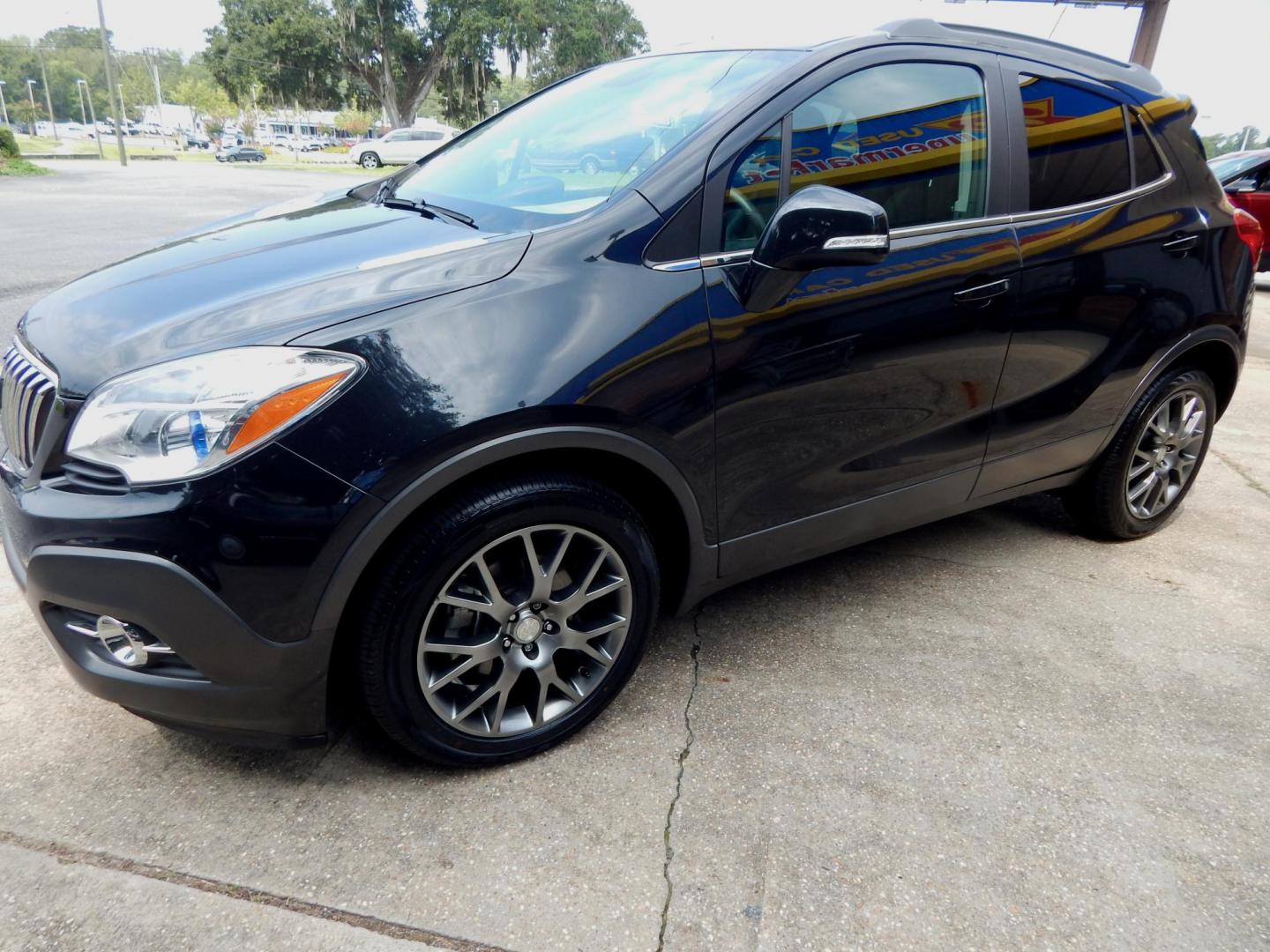 2016 Black /Charcoal Buick Encore Sport Touring (KL4CJ1SM4GB) with an 1.4L engine, Automatic transmission, located at 3120 W Tennessee St, Tallahassee, FL, 32304-1002, (850) 575-6702, 30.458841, -84.349648 - Used Car Supermarket is proud to present you with this loaded immaculate 2016 Buick Encore Sport Touring with leather, sunroof and low miles. Used Car Supermarket prides itself in offering you the finest pre-owned vehicle in Tallahassee. Used Car Supermarket has been locally family owned and operate - Photo#1