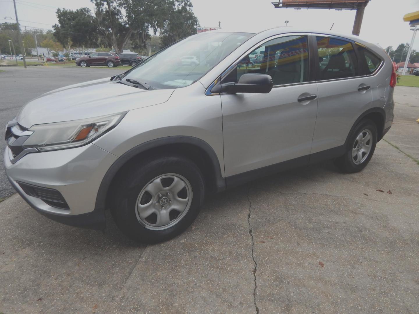 2015 Silver Metallic /Gray Honda CR-V LX 2WD (3CZRM3H39FG) with an 2.4L L4 DOHC 16V engine, Continuously Variable Transmission transmission, located at 3120 W Tennessee St, Tallahassee, FL, 32304-1002, (850) 575-6702, 30.458841, -84.349648 - Photo#1