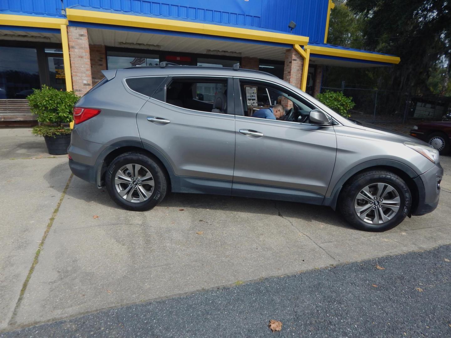 2015 Charcoal /Gray Hyundai Santa Fe Sport 2.4 AWD (5XYZUDLB5FG) with an 2.4L L4 DOHC 16V engine, 6-Speed Automatic transmission, located at 3120 W Tennessee St, Tallahassee, FL, 32304-1002, (850) 575-6702, 30.458841, -84.349648 - Used Car Supermarket is proud to present you with this loaded immaculate 2015 Hyundai Santa Fe Sport with low miles. Used Car Supermarket prides itself in offering you the finest pre-owned vehicle in Tallahassee. Used Car Supermarket has been locally family owned and operated for a half century. Our - Photo#0