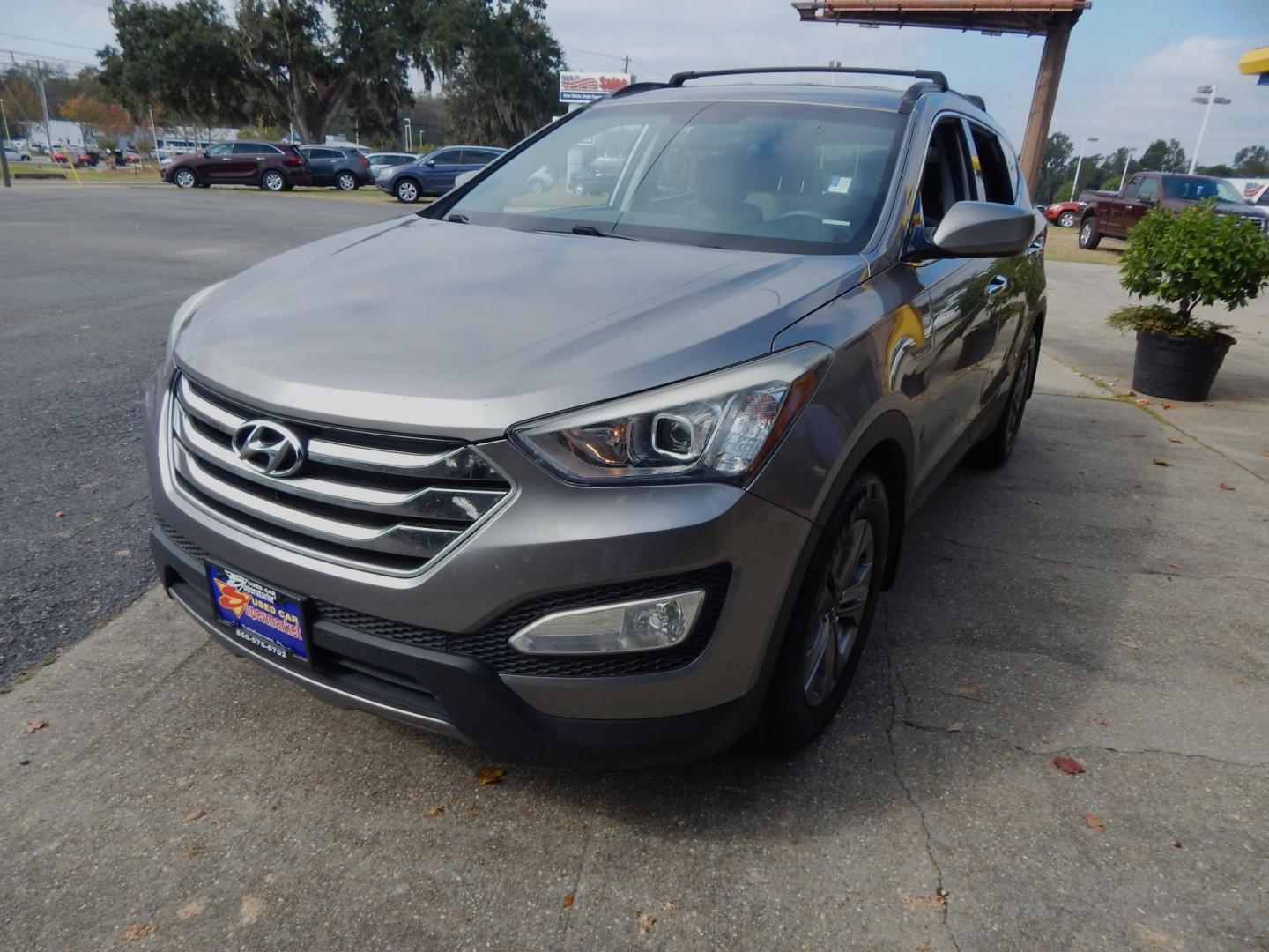 2015 Charcoal /Gray Hyundai Santa Fe Sport 2.4 AWD (5XYZUDLB5FG) with an 2.4L L4 DOHC 16V engine, 6-Speed Automatic transmission, located at 3120 W Tennessee St, Tallahassee, FL, 32304-1002, (850) 575-6702, 30.458841, -84.349648 - Used Car Supermarket is proud to present you with this loaded immaculate 2015 Hyundai Santa Fe Sport with low miles. Used Car Supermarket prides itself in offering you the finest pre-owned vehicle in Tallahassee. Used Car Supermarket has been locally family owned and operated for a half century. Our - Photo#1