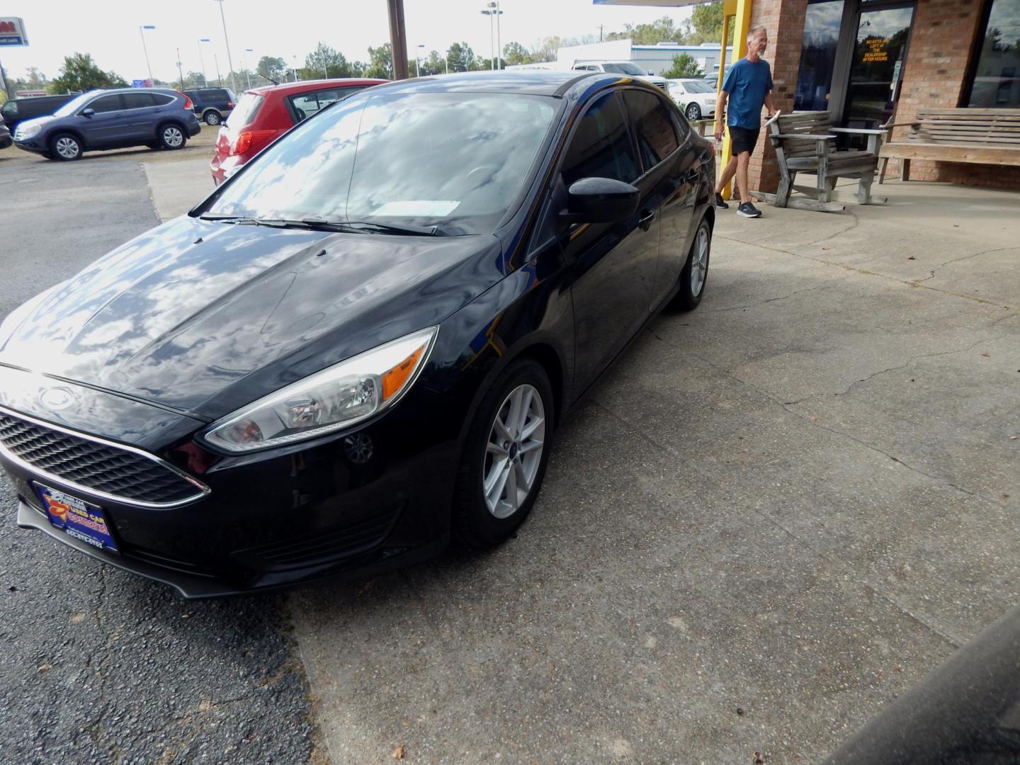 2018 Black /Charcoal Ford Focus SE Sedan (1FADP3FE3JL) with an 1.0L L3 engine, Automatic transmission, located at 3120 W Tennessee St, Tallahassee, FL, 32304-1002, (850) 575-6702, 30.458841, -84.349648 - Used Car Supermarket is proud to present you with this loaded immaculate 2018 Ford Focus SE sedan with low miles. Used Car Supermarket prides itself in offering you the finest pre-owned vehicle in Tallahassee. Used Car Supermarket has been locally family owned and operated for a half century. Our Fo - Photo#1