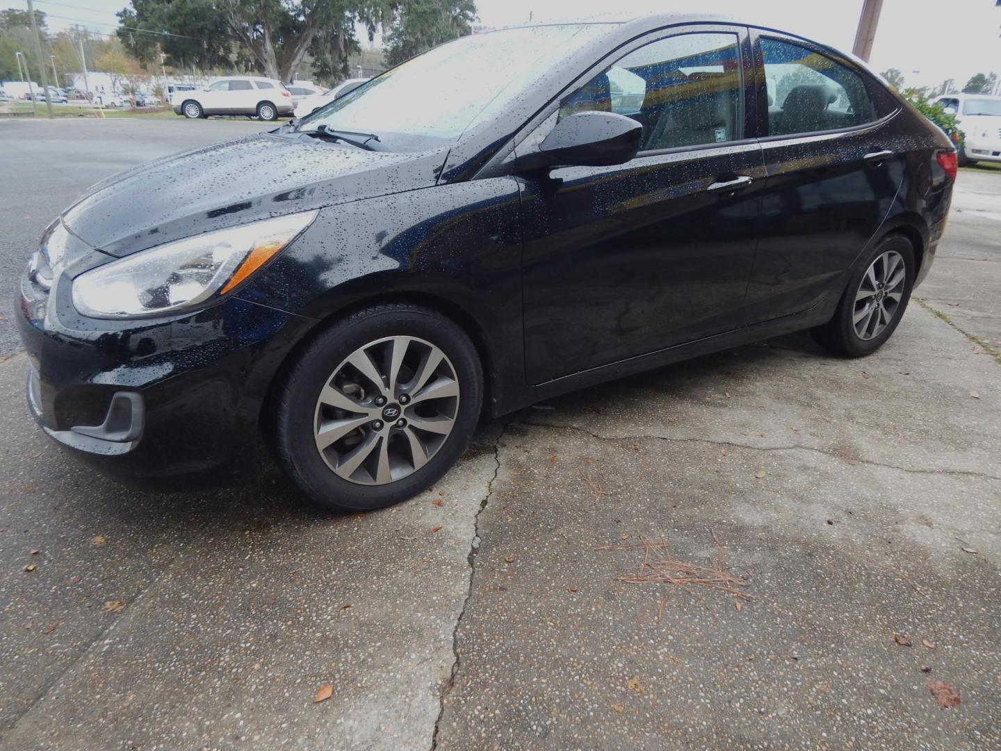 2017 Black /Gray Hyundai Accent SE 4-Door (KMHCT4AE7HU) with an 1.6L L4 DOHC 16V engine, Automatic transmission, located at 3120 W Tennessee St, Tallahassee, FL, 32304-1002, (850) 575-6702, 30.458841, -84.349648 - Used Car Supermarket is proud to present you with this loaded immaculate 2017 Hyundai Accent SE with low miles. Used Car Supermarket prides itself in offering you the finest pre-owned vehicle in Tallahassee. Used Car Supermarket has been locally family owned and operated for a half century. Our Acce - Photo#1