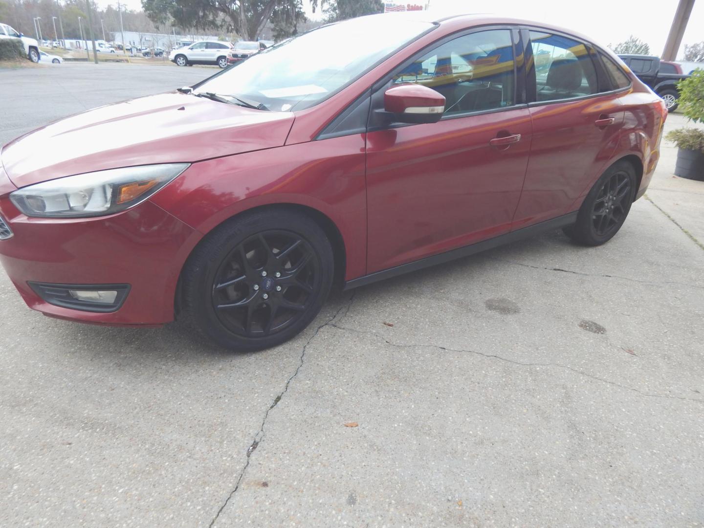 2016 Red /Charcoal Ford Focus SE Sedan (1FADP3F2XGL) with an 2.0L L4 DOHC 16V engine, Automatic transmission, located at 3120 W Tennessee St, Tallahassee, FL, 32304-1002, (850) 575-6702, 30.458841, -84.349648 - Used Car Supermarket is proud to present you with this loaded immaculate 2016 Ford Focus SE Sedan with low miles. Used Car Supermarket prides itself in offering you the finest pre-owned vehicle in Tallahassee. Used Car Supermarket has been locally family owned and operated for over 49 years. Our Foc - Photo#0