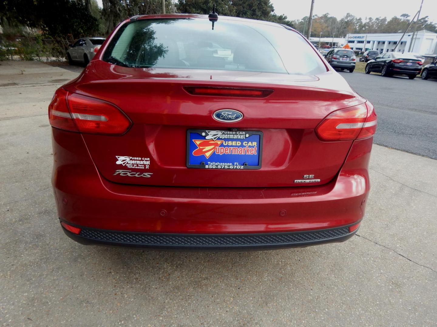 2016 Red /Charcoal Ford Focus SE Sedan (1FADP3F2XGL) with an 2.0L L4 DOHC 16V engine, Automatic transmission, located at 3120 W Tennessee St, Tallahassee, FL, 32304-1002, (850) 575-6702, 30.458841, -84.349648 - Photo#1