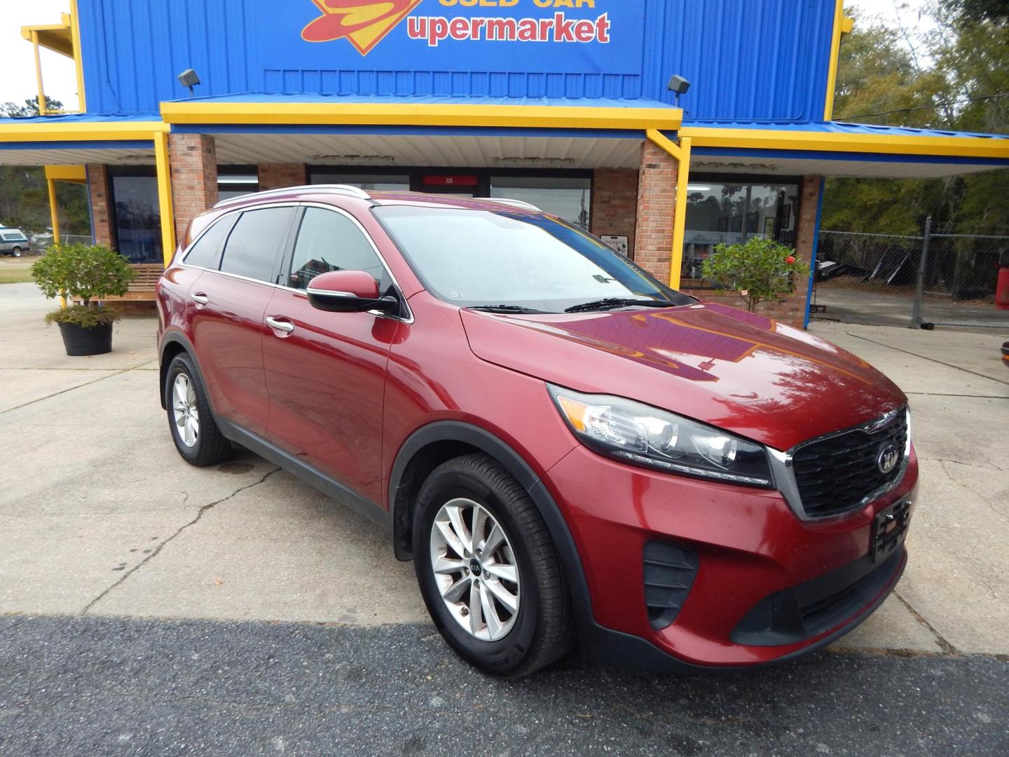 2019 Maroon /Gray Kia Sorento LX 2WD (5XYPG4A33KG) with an 2.4L L4 DOHC 16V engine, Automatic transmission, located at 3120 W Tennessee St, Tallahassee, FL, 32304-1002, (850) 575-6702, 30.458841, -84.349648 - Used Car Supermarket is proud to present you with this loaded immaculate 2019 Kia Sorento LX with 3rd row seating and great miles. Used Car Supermarket prides itself in offering you the finest pre-owned vehicle in Tallahassee. Used Car Supermarket has been locally family owned and operated for over - Photo#0