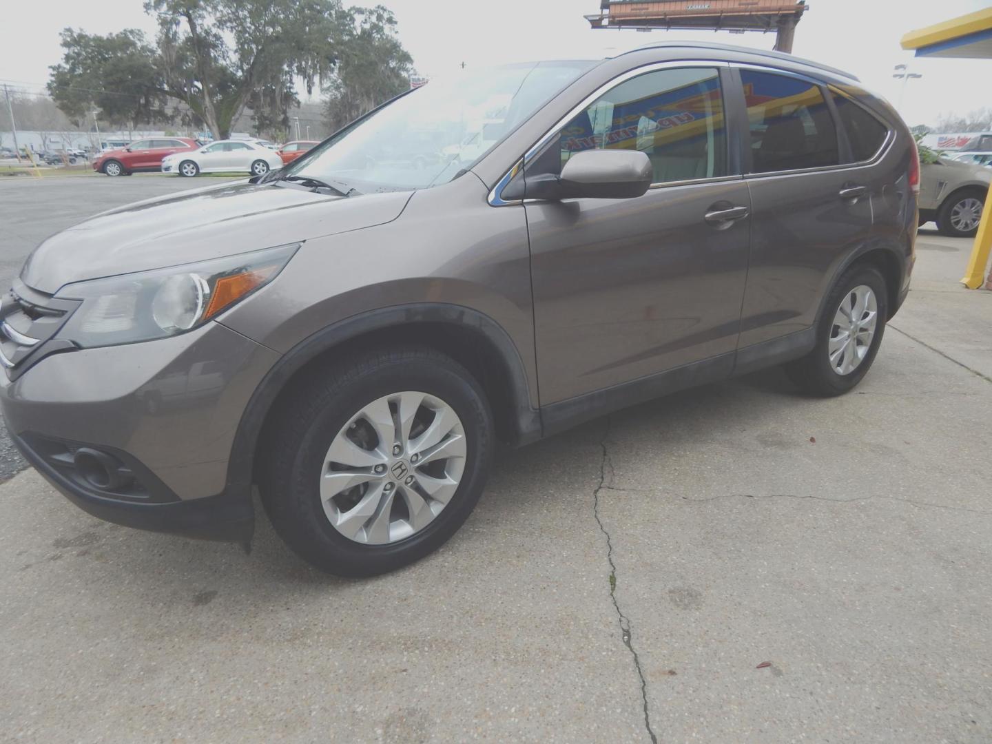 2013 Taupe /Tan Leather Honda CR-V EX-L 2WD 5-Speed AT (5J6RM3H72DL) with an 2.4L L4 DOHC 16V engine, Automatic transmission, located at 3120 W Tennessee St, Tallahassee, FL, 32304-1002, (850) 575-6702, 30.458841, -84.349648 - Used Car Supermarket is proud to present you with this loaded immaculate 2013 Honda CRV EX-L with leather, sunroof and low miles. Used Car Supermarket prides itself in offering you the finest pre-owned vehicle in Tallahassee. Used Car Supermarket has been locally family owned and operated for over 4 - Photo#1