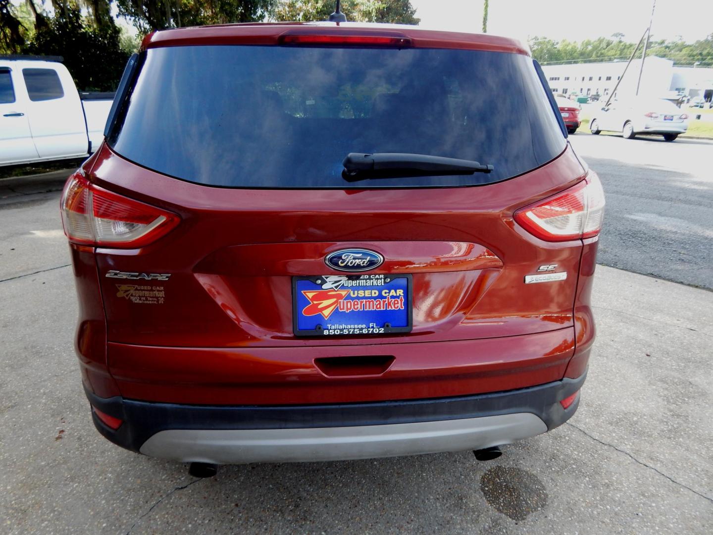 2014 Maroon /Two Tone Gray Ford Escape SE FWD (1FMCU0GX8EU) with an 1.6L L4 DOHC 16V engine, Automatic transmission, located at 3120 W Tennessee St, Tallahassee, FL, 32304-1002, (850) 575-6702, 30.458841, -84.349648 - Used Car Supermarket is proud to present you with this loaded immaculate 2014 Ford Escape SE with low miles. Used Car Supermarket prides itself in offering you the finest pre-owned vehicle in Tallahassee. Used Car Supermarket has been locally family owned and operated for over a half century. Our Es - Photo#3