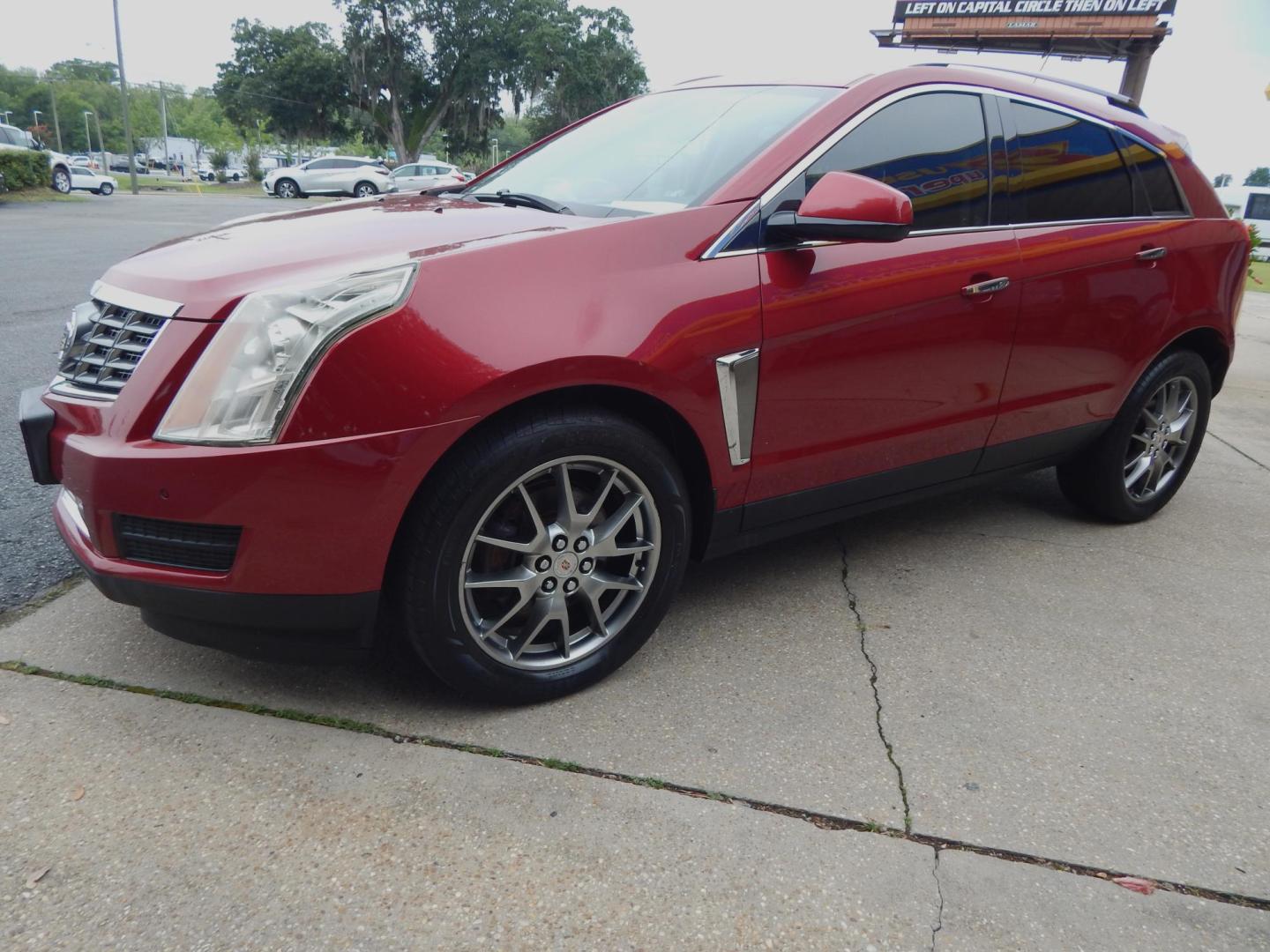 2014 Maroon /Tan Leather Cadillac SRX Luxury Collection AWD (3GYFNEE31ES) with an 3.6L V6 DOHC 24V FFV engine, 6-Speed Automatic transmission, located at 3120 W Tennessee St, Tallahassee, FL, 32304-1002, (850) 575-6702, 30.458841, -84.349648 - Used Car Supermarket is proud to present you with this loaded immaculate 2014 Cadillac SRX Luxury with sunroof and leather. Used Car Supermarket prides itself in offering you the finest pre-owned vehicle in Tallahassee. Used Car Supermarket has been locally family owned and operated for over 49 year - Photo#1
