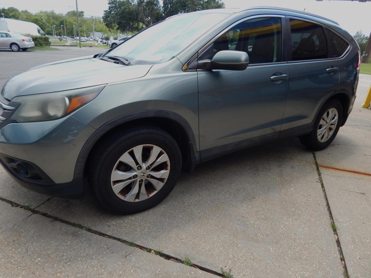 2012 Sage /Charcoal Leather Honda CR-V EX-L 2WD AT (5J6RM3H72CL) with an 2.4L L4 DOHC 16V engine, Automatic transmission, located at 3120 W Tennessee St, Tallahassee, FL, 32304-1002, (850) 575-6702, 30.458841, -84.349648 - Used Car Supermarket is proud to present you with this loaded immaculate 2012 Honda CRV EXL with leather, sunroof and low miles. Used Car Supermarket prides itself in offering you the finest pre-owned vehicle in Tallahassee. Used Car Supermarket has been locally family owned and operated for over 49 - Photo#1