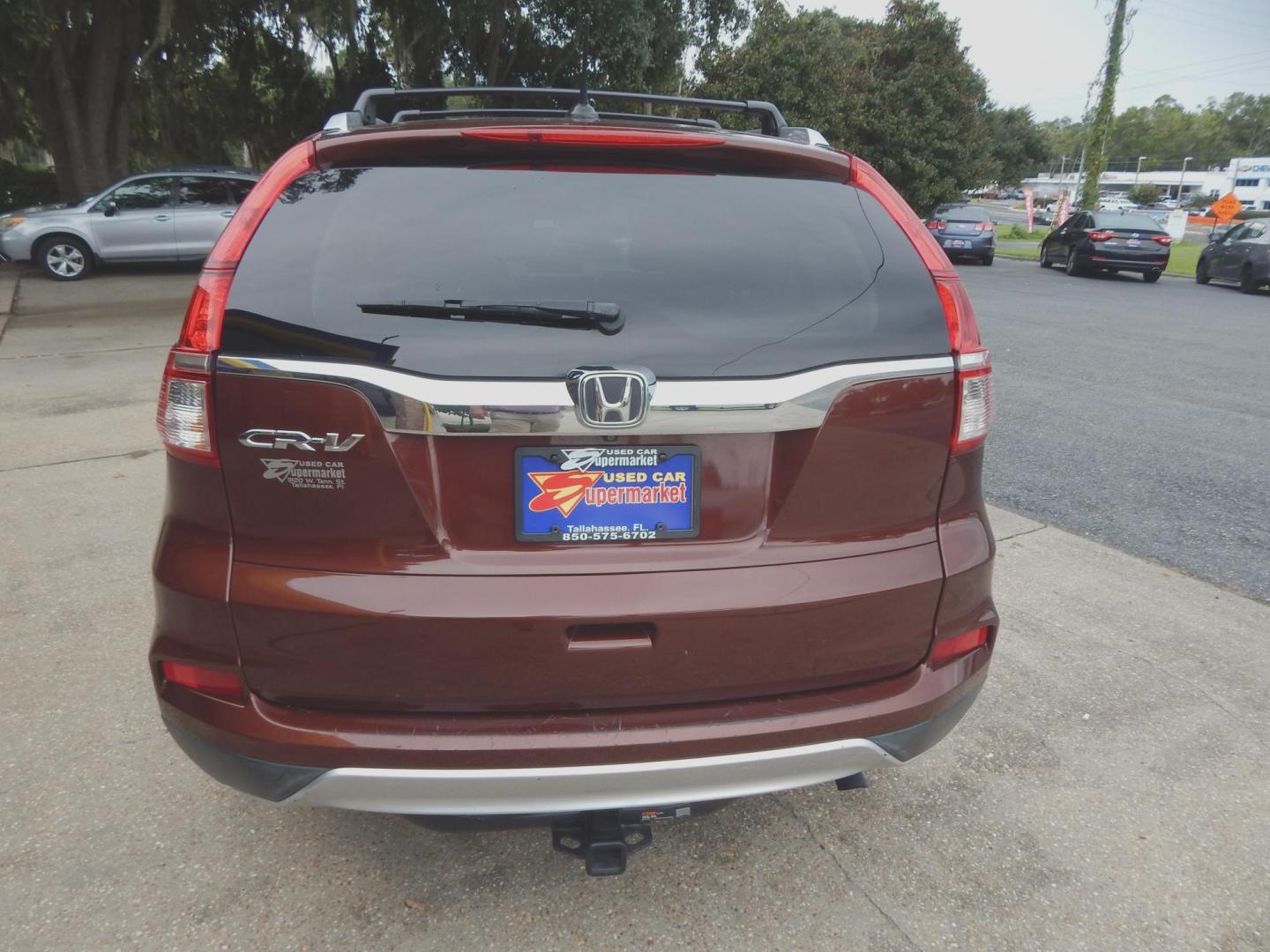 2016 Maroon /Charcoal Leather Honda CR-V EX-L 2WD (2HKRM3H77GH) with an 2.4L L4 DOHC 16V engine, Automatic transmission, located at 3120 W Tennessee St, Tallahassee, FL, 32304-1002, (850) 575-6702, 30.458841, -84.349648 - Used Car Supermarket is proud to present you with this loaded immaculate 2016 Honda CRV EX-L with sunroof, leather and low miles. Used Car Supermarket prides itself in offering you the finest pre-owned vehicle in Tallahassee. Used Car Supermarket has been locally family owned and operated for over 5 - Photo#3