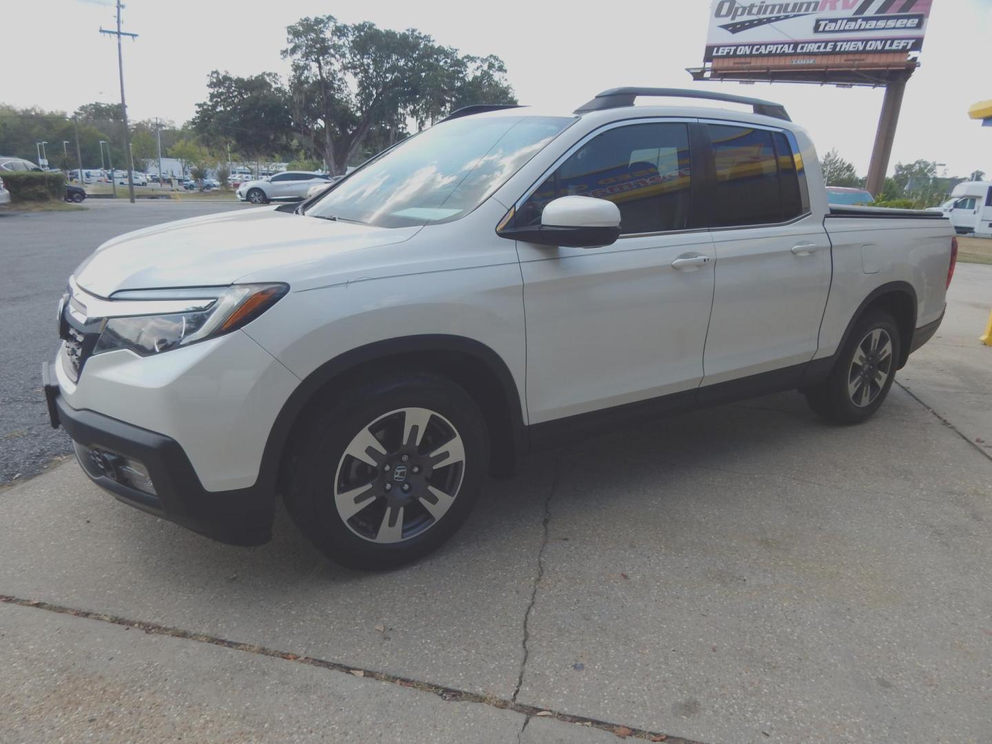 2017 Pearl White /Gray Leather Honda Ridgeline RTL-T (5FPYK2F64HB) with an 3.5L V6 SOHC 24V engine, Automatic transmission, located at 3120 W Tennessee St, Tallahassee, FL, 32304-1002, (850) 575-6702, 30.458841, -84.349648 - Used Car Supermarket is proud to present you with this loaded immaculate 2017 Honda Ridgeline RLT-T with Navigation and leather. Used Car Supermarket prides itself in offering you the finest pre-owned vehicle in Tallahassee. Used Car Supermarket has been locally family owned and operated for over 50 - Photo#1