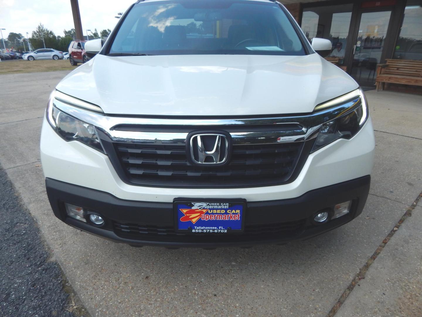 2017 Pearl White /Gray Leather Honda Ridgeline RTL-T (5FPYK2F64HB) with an 3.5L V6 SOHC 24V engine, Automatic transmission, located at 3120 W Tennessee St, Tallahassee, FL, 32304-1002, (850) 575-6702, 30.458841, -84.349648 - Used Car Supermarket is proud to present you with this loaded immaculate 2017 Honda Ridgeline RLT-T with Navigation and leather. Used Car Supermarket prides itself in offering you the finest pre-owned vehicle in Tallahassee. Used Car Supermarket has been locally family owned and operated for over 50 - Photo#2