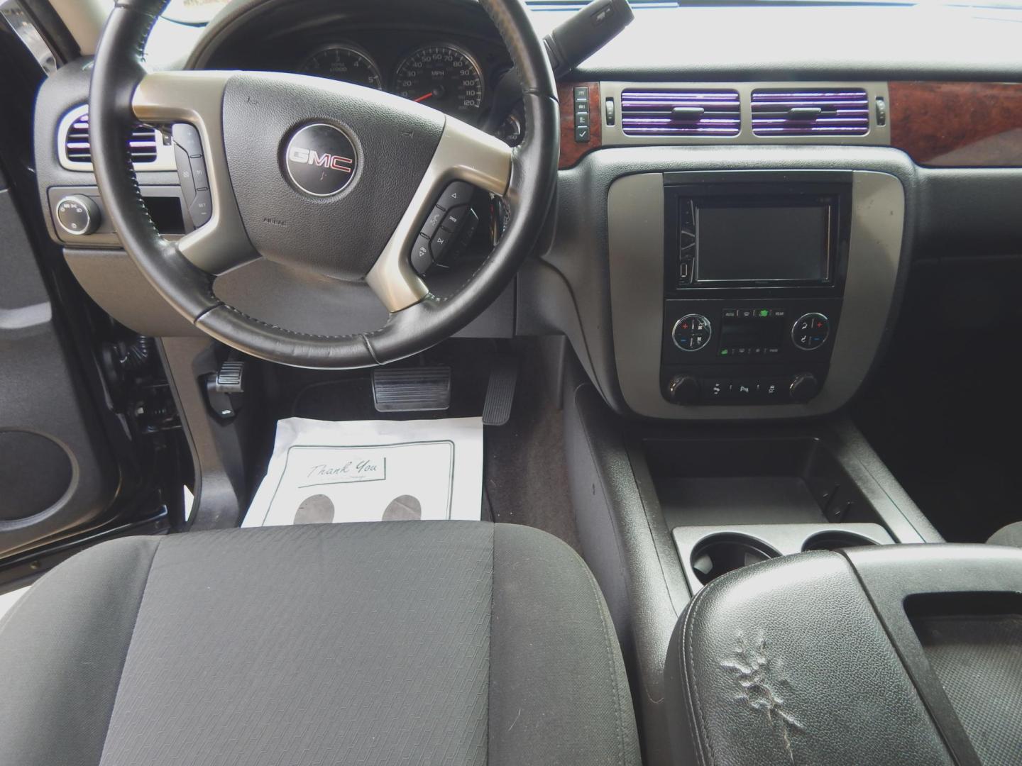 2013 Black /Charcoal GMC Yukon SLE 2WD (1GKS1AE00DR) with an 5.3L V8 OHV 16V FFV engine, 6-Speed Automatic transmission, located at 3120 W Tennessee St, Tallahassee, FL, 32304-1002, (850) 575-6702, 30.458841, -84.349648 - Used Car Supermarket is proud to present you with this loaded immaculate 2013 GMC Yukon SLE with 3rd row seating. Used Car Supermarket prides itself in offering you the finest pre-owned vehicle in Tallahassee. Used Car Supermarket has been locally family owned and operated for over 50 years. Our Yuk - Photo#7