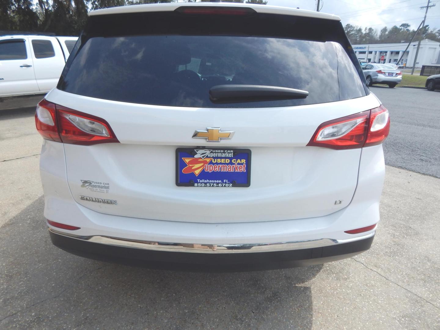 2021 White /Charcoal Chevrolet Equinox LT 2WD (3GNAXKEV7MS) with an 1.5L L4 DOHC 16V TURBO engine, Automatic transmission, located at 3120 W Tennessee St, Tallahassee, FL, 32304-1002, (850) 575-6702, 30.458841, -84.349648 - Used Car Supermarket is proud to present you with this loaded immaculate 2021 Chevy Equinox LT. Used Car Supermarket prides itself in offering you the finest pre-owned vehicle in Tallahassee. Used Car Supermarket has been locally family owned and operated for over 50 years. Our Equinox LT has been s - Photo#3