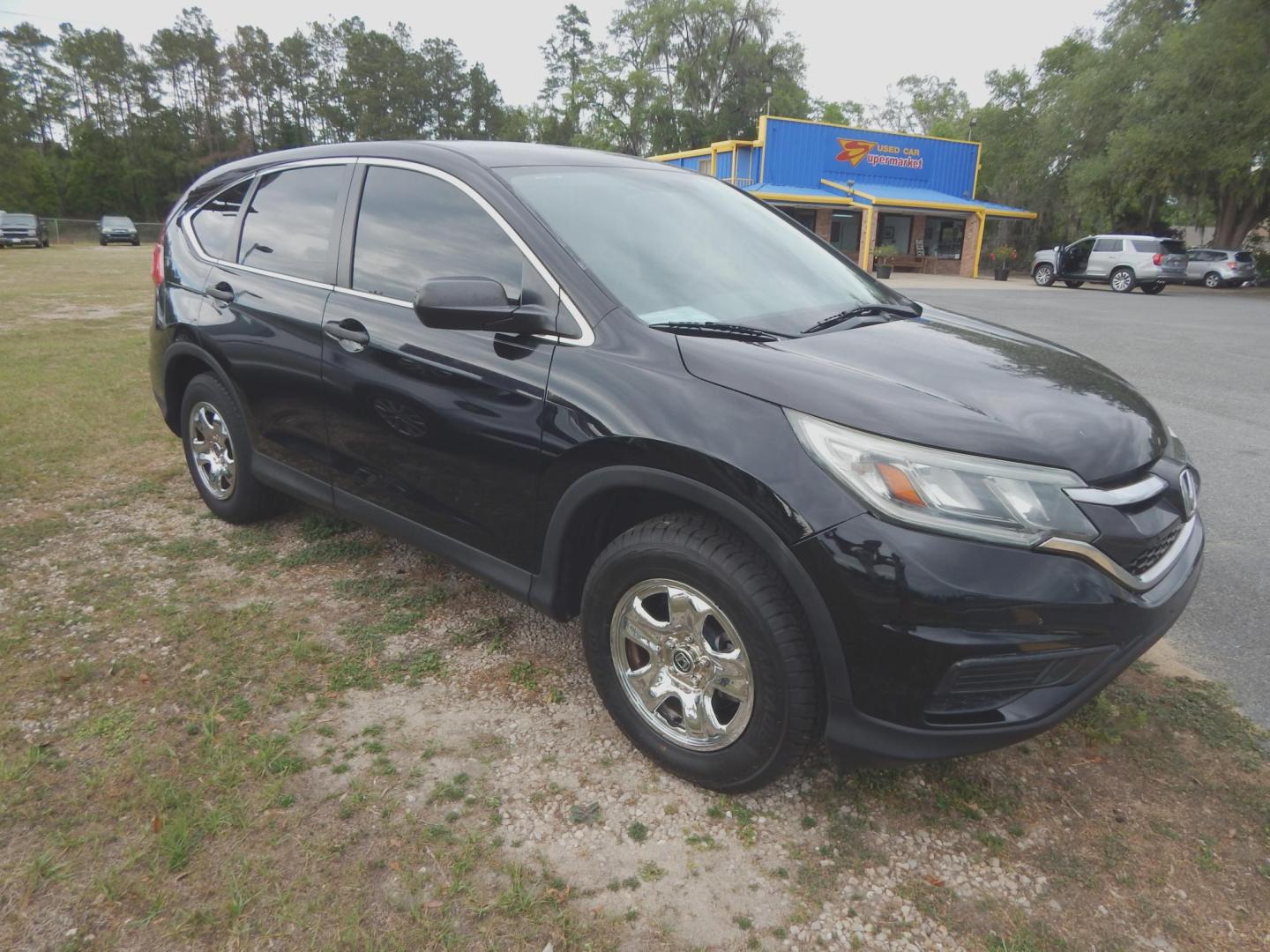2016 Black /Charcoal Honda CR-V LX 2WD (2HKRM3H38GH) with an 2.4L L4 DOHC 16V engine, CVT transmission, located at 3120 W Tennessee St, Tallahassee, FL, 32304-1002, (850) 575-6702, 30.458841, -84.349648 - Used Car Supermarket is proud to present you with this loaded immaculate 2016 Honda CRV LX. Used Car Supermarket prides itself in offering you the finest pre-owned vehicle in Tallahassee. Used Car Supermarket has been locally family owned and operated for over 50 years. Our CRV LX has been serviced - Photo#1
