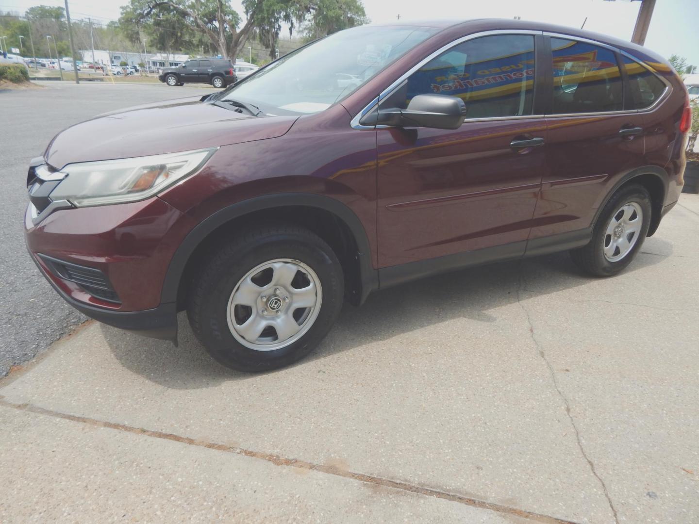 2015 Maroon /Gray Honda CR-V LX 2WD (2HKRM3H39FH) with an 2.4L L4 DOHC 16V engine, Automatic transmission, located at 3120 W Tennessee St, Tallahassee, FL, 32304-1002, (850) 575-6702, 30.458841, -84.349648 - Used Car Supermarket is proud to present you with this loaded immaculate 2015 Honda CRV LX. Used Car Supermarket prides itself in offering you the finest pre-owned vehicle in Tallahassee. Used Car Supermarket has been locally family owned and operated for over 50 years. Our CRV LX has been serviced - Photo#1