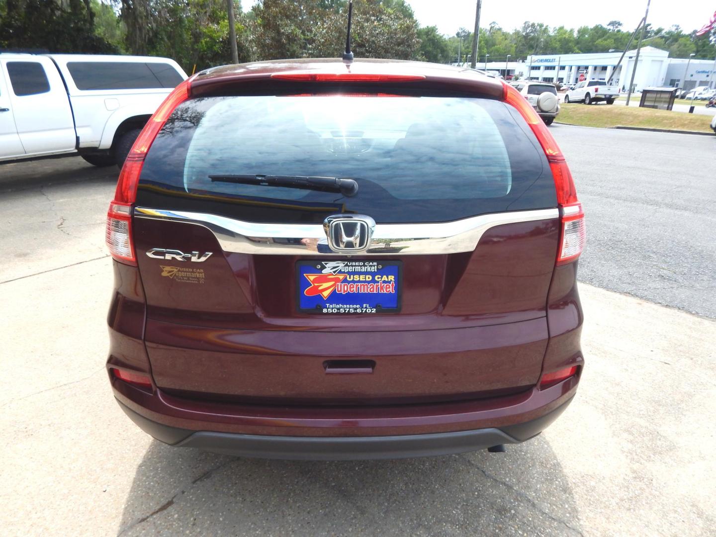 2015 Maroon /Gray Honda CR-V LX 2WD (2HKRM3H39FH) with an 2.4L L4 DOHC 16V engine, Automatic transmission, located at 3120 W Tennessee St, Tallahassee, FL, 32304-1002, (850) 575-6702, 30.458841, -84.349648 - Used Car Supermarket is proud to present you with this loaded immaculate 2015 Honda CRV LX. Used Car Supermarket prides itself in offering you the finest pre-owned vehicle in Tallahassee. Used Car Supermarket has been locally family owned and operated for over 50 years. Our CRV LX has been serviced - Photo#2
