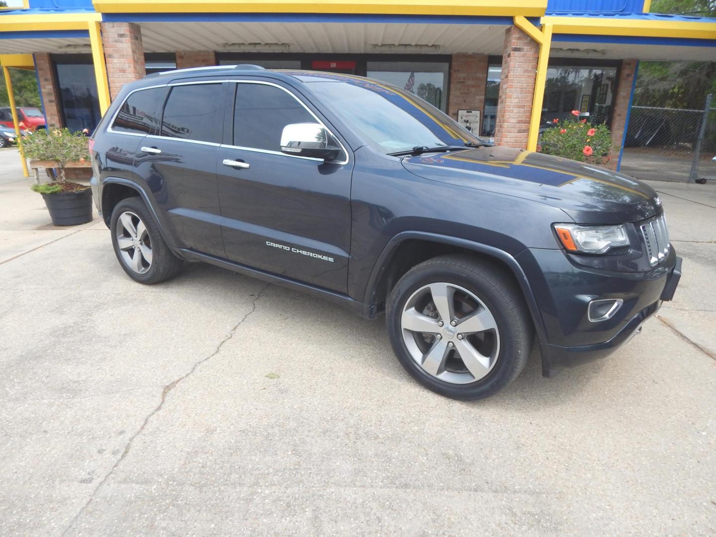 2014 Black /Charcoal Leather Jeep Grand Cherokee Overland 4WD (1C4RJFCG8EC) with an 3.6L V6 DOHC 24V engine, Automatic transmission, located at 3120 W Tennessee St, Tallahassee, FL, 32304-1002, (850) 575-6702, 30.458841, -84.349648 - Used Car Supermarket is proud to present you with this loaded immaculate 2014 Jeep Grand Cherokee Overland 4X4 with leather, Navigation and low miles. Used Car Supermarket prides itself in offering you the finest pre-owned vehicle in Tallahassee. Used Car Supermarket has been locally family owned an - Photo#0