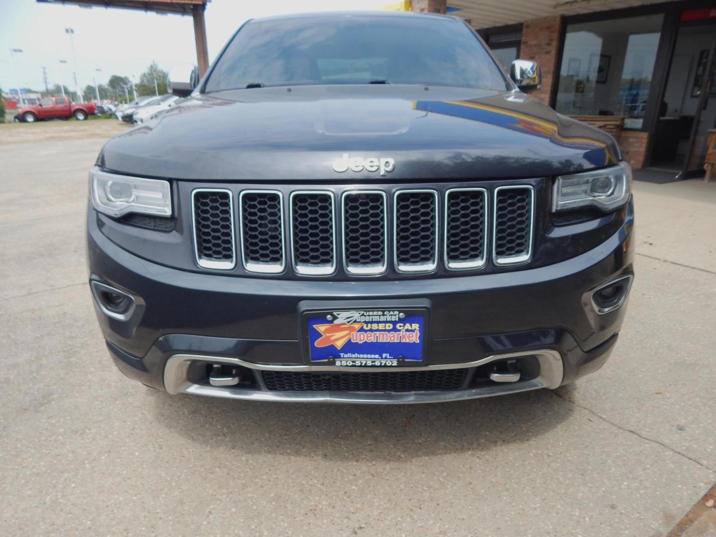 2014 Black /Charcoal Leather Jeep Grand Cherokee Overland 4WD (1C4RJFCG8EC) with an 3.6L V6 DOHC 24V engine, Automatic transmission, located at 3120 W Tennessee St, Tallahassee, FL, 32304-1002, (850) 575-6702, 30.458841, -84.349648 - Used Car Supermarket is proud to present you with this loaded immaculate 2014 Jeep Grand Cherokee Overland 4X4 with leather, Navigation and low miles. Used Car Supermarket prides itself in offering you the finest pre-owned vehicle in Tallahassee. Used Car Supermarket has been locally family owned an - Photo#2