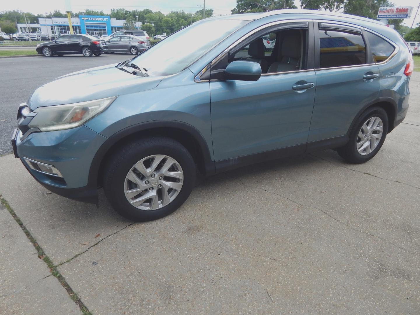 2015 Teal /Tan Leather Honda CR-V EX-L 2WD (2HKRM3H76FH) with an 2.4L L4 DOHC 16V engine, Continuously Variable Transmission transmission, located at 3120 W Tennessee St, Tallahassee, FL, 32304-1002, (850) 575-6702, 30.458841, -84.349648 - Used Car Supermarket is proud to present you with this loaded immaculate 2015 Honda CRV EX-L with leather, Navigation and sunroof. Used Car Supermarket prides itself in offering you the finest pre-owned vehicle in Tallahassee. Used Car Supermarket has been locally family owned and operated for over- Photo#1