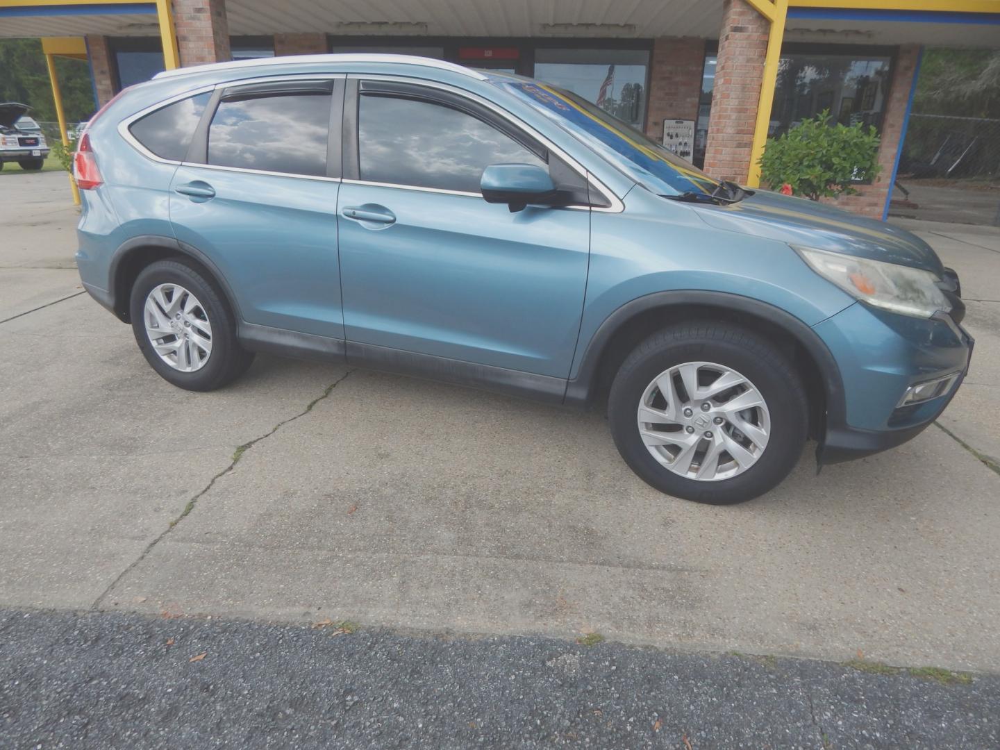2015 Teal /Tan Leather Honda CR-V EX-L 2WD (2HKRM3H76FH) with an 2.4L L4 DOHC 16V engine, Continuously Variable Transmission transmission, located at 3120 W Tennessee St, Tallahassee, FL, 32304-1002, (850) 575-6702, 30.458841, -84.349648 - Used Car Supermarket is proud to present you with this loaded immaculate 2015 Honda CRV EX-L with leather, Navigation and sunroof. Used Car Supermarket prides itself in offering you the finest pre-owned vehicle in Tallahassee. Used Car Supermarket has been locally family owned and operated for over- Photo#0
