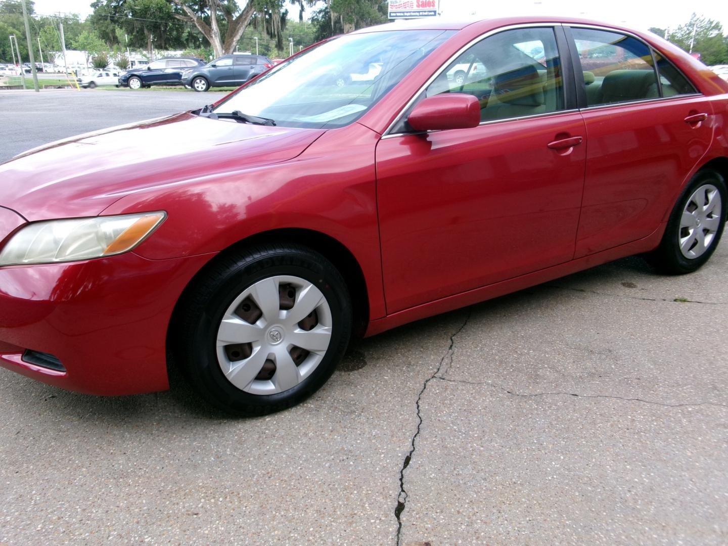 2007 Red /Tan Toyota Camry LE V6 (4T1BK46K17U) with an 3.5L V6 DOHC 24V engine, Automatic transmission, located at 3120 W Tennessee St, Tallahassee, FL, 32304-1002, (850) 575-6702, 30.458841, -84.349648 - Used Car Supermarket is proud to present you with this loaded immaculate 2007 Toyota Camry LE V6 with low miles. Used Car Supermarket prides itself in offering you the finest pre-owned vehicle in Tallahassee. Used Car Supermarket has been locally family owned and operated for over 50 years. Our Camr- Photo#2