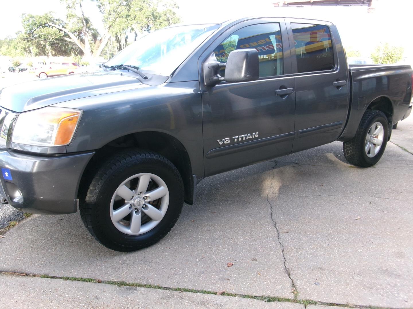 2011 Charcoal /Gray Nissan Titan SV Crew Cab 4WD SWB (1N6AA0EJ4BN) with an 5.6L V8 DOHC 32V engine, Automatic transmission, located at 3120 W Tennessee St, Tallahassee, FL, 32304-1002, (850) 575-6702, 30.458841, -84.349648 - Used Car Supermarket is proud to present you with this loaded immaculate 2011 Nissan Titan SV Crew Cab 4x4. Used Car Supermarket prides itself in offering you the finest pre-owned vehicle in Tallahassee. Used Car Supermarket has been locally family owned and operated for over 50 years. Our Titan 4x- Photo#1