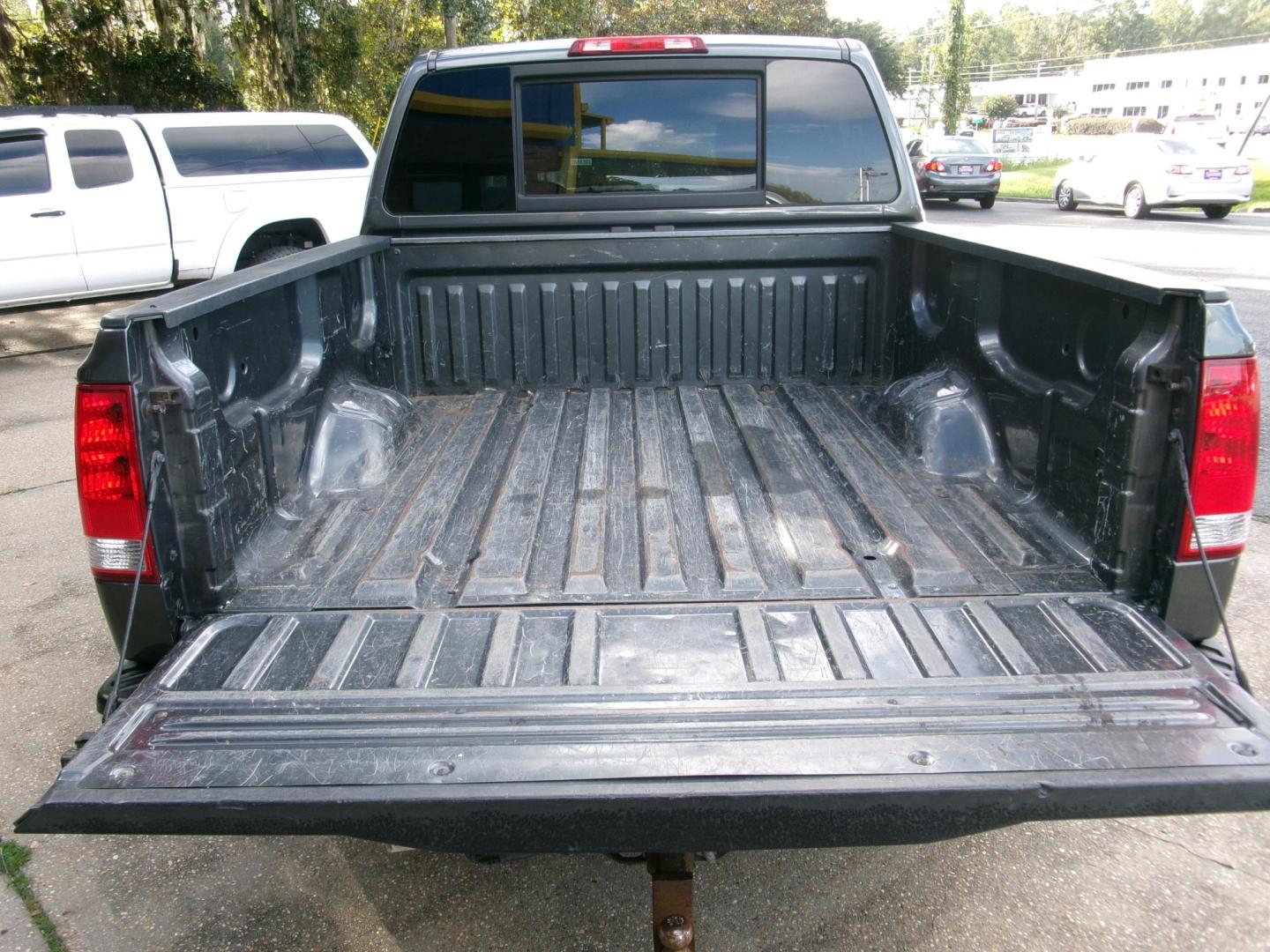 2011 Charcoal /Gray Nissan Titan SV Crew Cab 4WD SWB (1N6AA0EJ4BN) with an 5.6L V8 DOHC 32V engine, Automatic transmission, located at 3120 W Tennessee St, Tallahassee, FL, 32304-1002, (850) 575-6702, 30.458841, -84.349648 - Used Car Supermarket is proud to present you with this loaded immaculate 2011 Nissan Titan SV Crew Cab 4x4. Used Car Supermarket prides itself in offering you the finest pre-owned vehicle in Tallahassee. Used Car Supermarket has been locally family owned and operated for over 50 years. Our Titan 4x- Photo#4